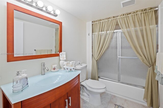 801 Sw 141 101O, Pembroke Pines, FL 33027 - bathroom with visible vents, tile patterned flooring, vanity, toilet, and shower / bath combination with glass door