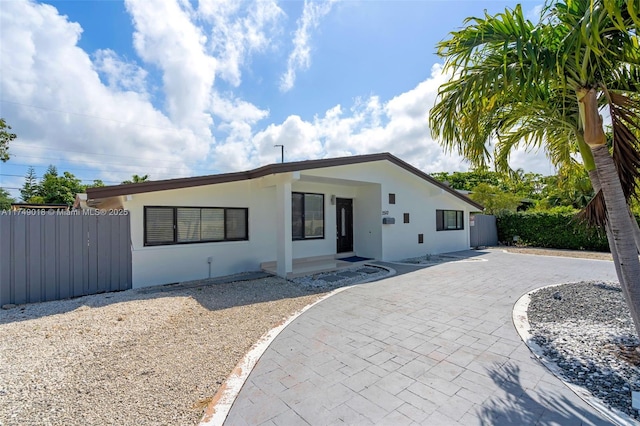 2510 NE 215th St, Miami, FL 33180 - single story home featuring stucco siding, fence, a patio area, and driveway