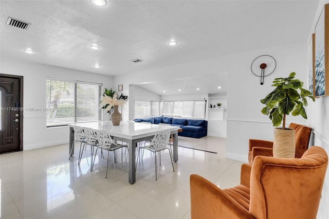 2510 NE 215th St, Miami, FL 33180 - dining space featuring plenty of natural light, baseboards, and light tile patterned floors