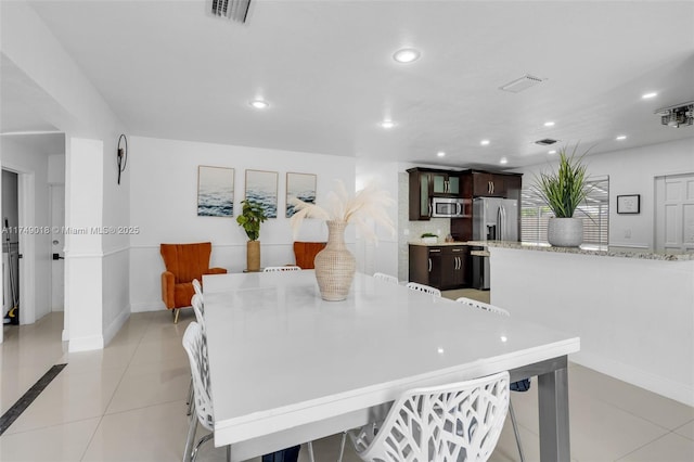 2510 NE 215th St, Miami, FL 33180 - dining room featuring baseboards, light tile patterned flooring, visible vents, and recessed lighting