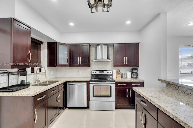 2510 NE 215th St, Miami, FL 33180 - kitchen with light stone counters, tasteful backsplash, a sink, wall chimney exhaust hood, and appliances with stainless steel finishes