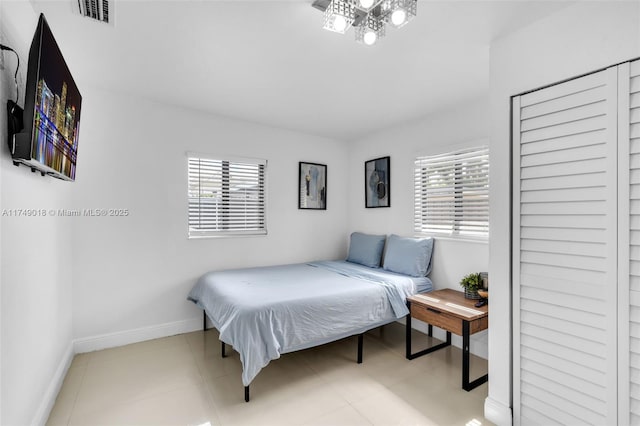 2510 NE 215th St, Miami, FL 33180 - bedroom featuring baseboards, multiple windows, and visible vents