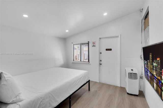 2510 NE 215th St, Miami, FL 33180 - bedroom with recessed lighting, vaulted ceiling, and light wood-type flooring