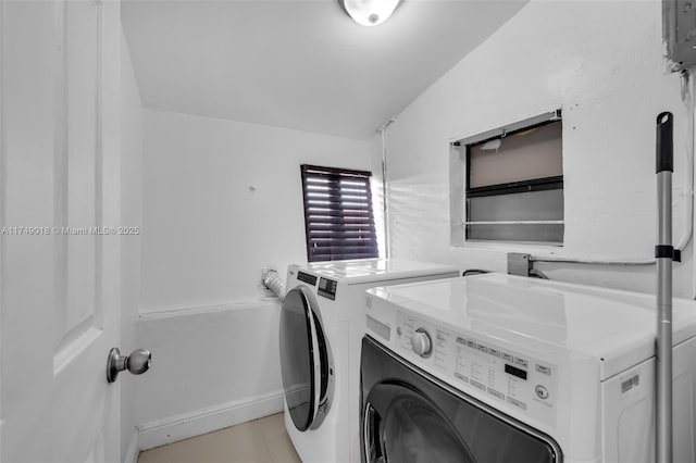 2510 NE 215th St, Miami, FL 33180 - clothes washing area featuring washer and dryer, laundry area, and light tile patterned floors