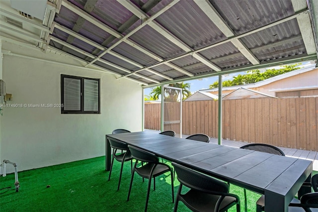 2510 NE 215th St, Miami, FL 33180 - view of patio / terrace featuring outdoor dining area and fence