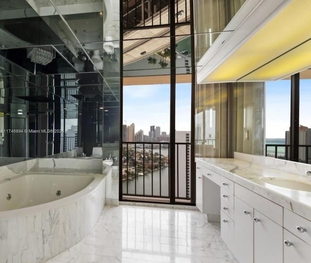 bathroom with a view of city, marble finish floor, plenty of natural light, and a whirlpool tub