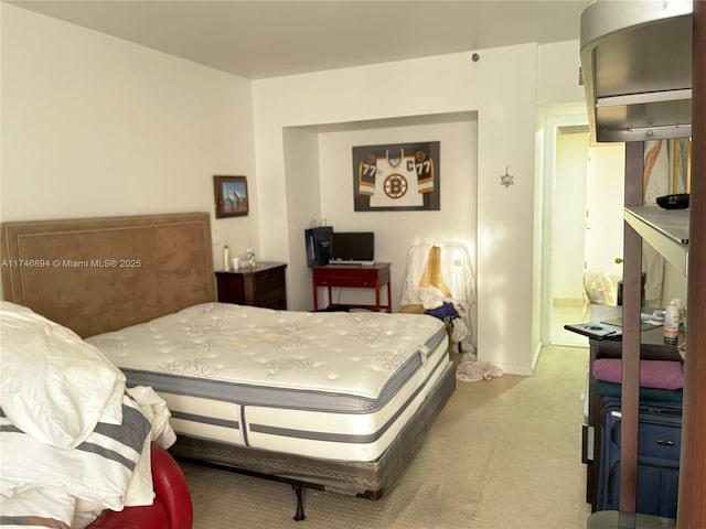 bedroom featuring light colored carpet