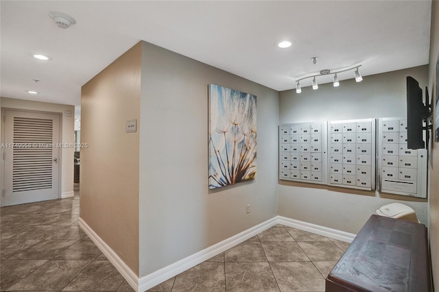 interior space with recessed lighting, baseboards, mail area, and tile patterned floors