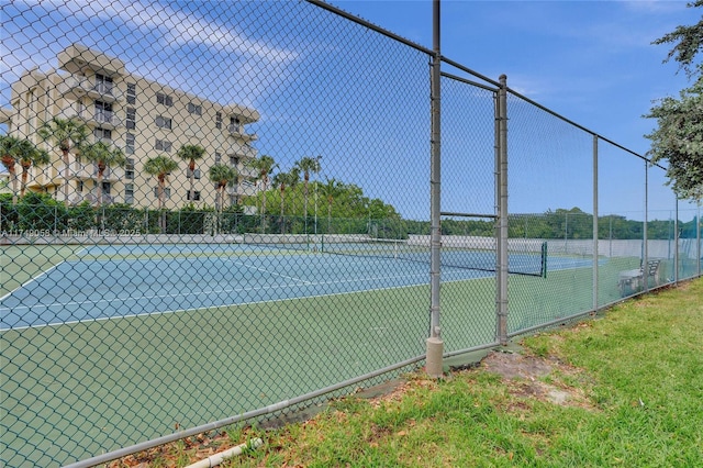 view of sport court with fence