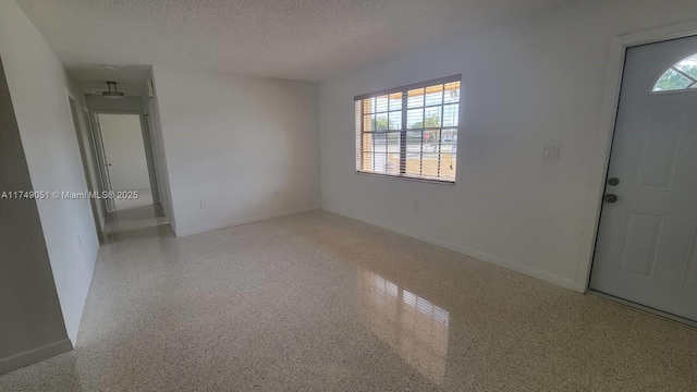 11715 SW 183rd St, Miami, FL 33177 - foyer with a textured ceiling and baseboards