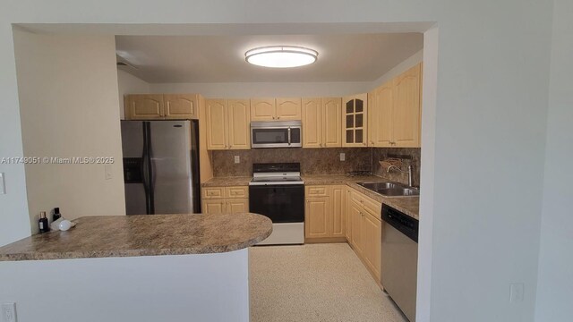 11715 SW 183rd St, Miami, FL 33177 - kitchen with appliances with stainless steel finishes, a sink, decorative backsplash, glass insert cabinets, and light brown cabinetry