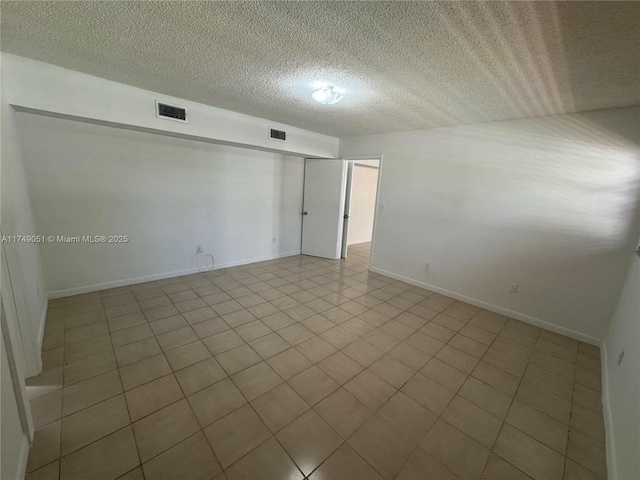 11715 SW 183rd St, Miami, FL 33177 - empty room featuring a textured ceiling and baseboards