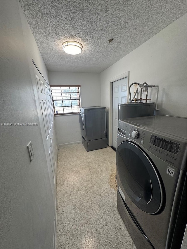 11715 SW 183rd St, Miami, FL 33177 - washroom featuring water heater, a textured ceiling, and washing machine and clothes dryer
