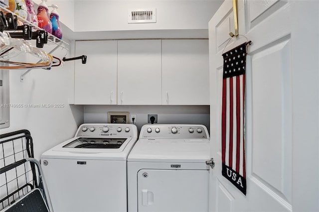 laundry area with visible vents, cabinet space, and independent washer and dryer