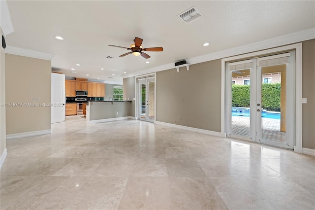 unfurnished living room featuring recessed lighting, visible vents, baseboards, french doors, and crown molding