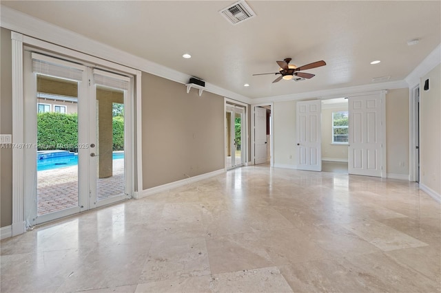 empty room featuring ornamental molding, french doors, visible vents, and baseboards