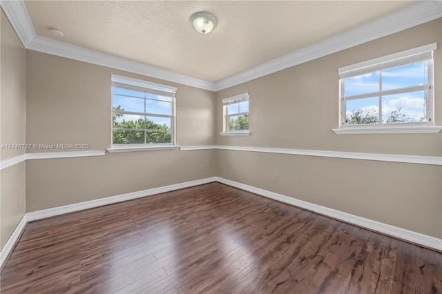 unfurnished room with dark wood-style floors, crown molding, a textured ceiling, and baseboards