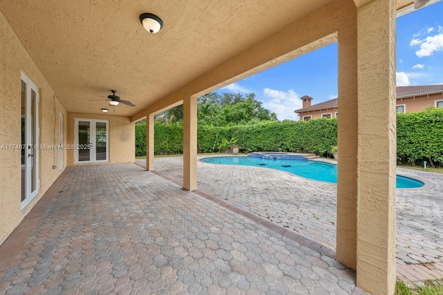 view of patio featuring a pool with connected hot tub and ceiling fan