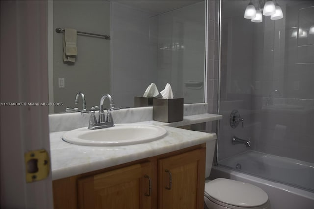 bathroom featuring shower / bath combination with glass door, vanity, and toilet