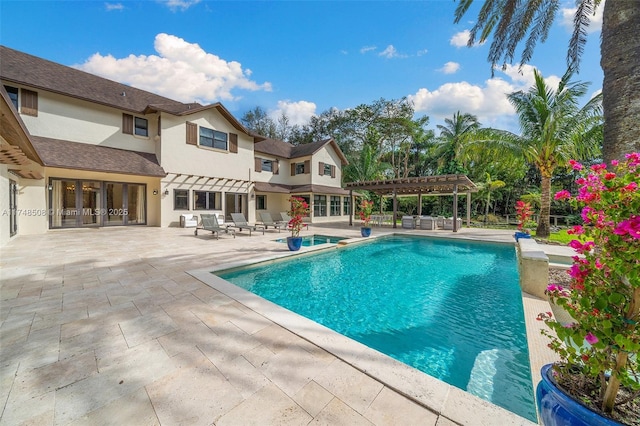 pool with a patio and a pergola