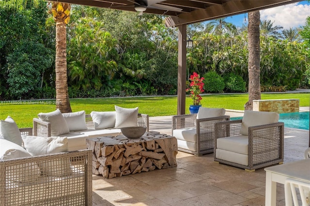 view of patio featuring ceiling fan and an outdoor living space