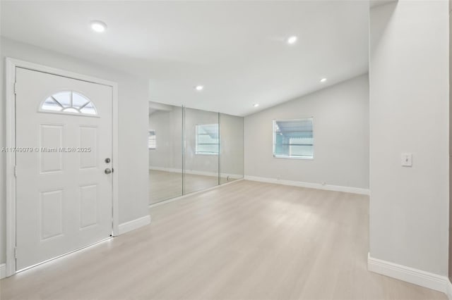 3883 Chickasha Rd, Lake Worth, FL 33462 - entrance foyer with light wood finished floors, recessed lighting, and vaulted ceiling