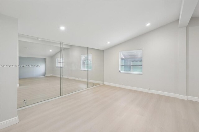 3883 Chickasha Rd, Lake Worth, FL 33462 - unfurnished bedroom featuring lofted ceiling, wood finished floors, and recessed lighting