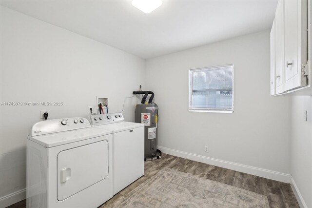 3883 Chickasha Rd, Lake Worth, FL 33462 - washroom with water heater, cabinet space, separate washer and dryer, and light wood-type flooring