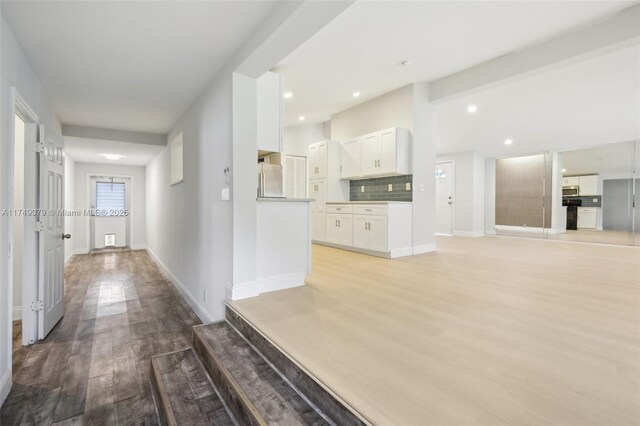 3883 Chickasha Rd, Lake Worth, FL 33462 - hallway with light wood finished floors and recessed lighting