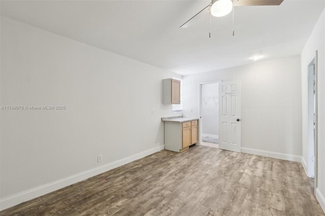 3883 Chickasha Rd, Lake Worth, FL 33462 - unfurnished living room featuring a ceiling fan and light wood-type flooring
