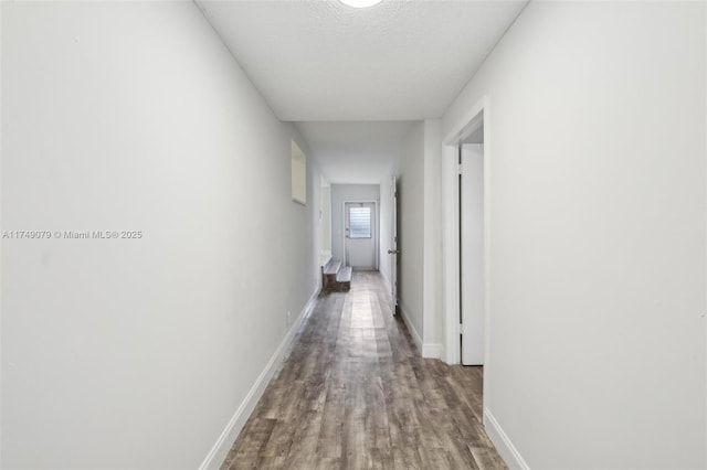 3883 Chickasha Rd, Lake Worth, FL 33462 - corridor with wood finished floors and baseboards