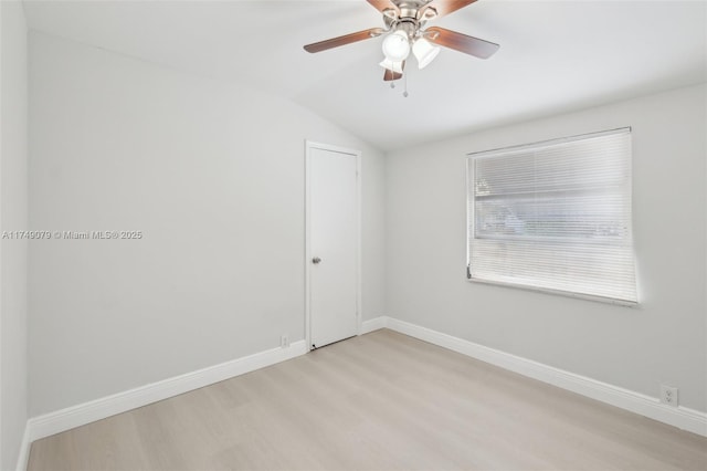 3883 Chickasha Rd, Lake Worth, FL 33462 - unfurnished room with light wood-style flooring, vaulted ceiling, and ceiling fan