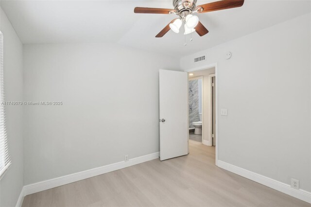 3883 Chickasha Rd, Lake Worth, FL 33462 - unfurnished room featuring ceiling fan, light wood-style flooring, and vaulted ceiling