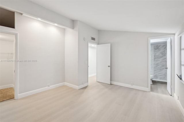 3883 Chickasha Rd, Lake Worth, FL 33462 - unfurnished bedroom featuring wood finished floors and connected bathroom
