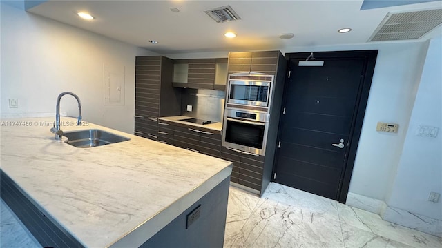 kitchen featuring marble finish floor, a center island with sink, stainless steel appliances, visible vents, and a sink