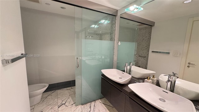 full bath featuring marble finish floor, a sink, and a shower stall