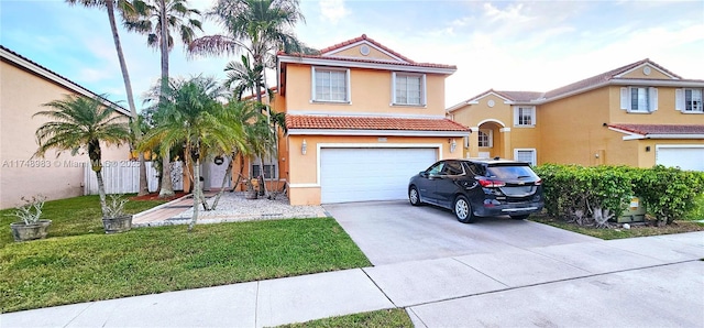 view of front of property featuring driveway, fence, a tiled roof, and stucco siding