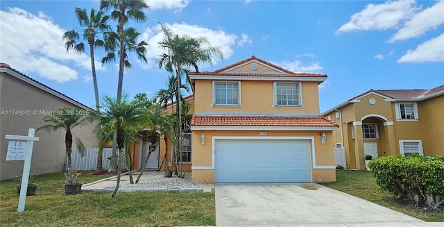 18860 NW 12th St, Pembroke Pines, FL 33029 - mediterranean / spanish home featuring a tile roof, stucco siding, an attached garage, and concrete driveway