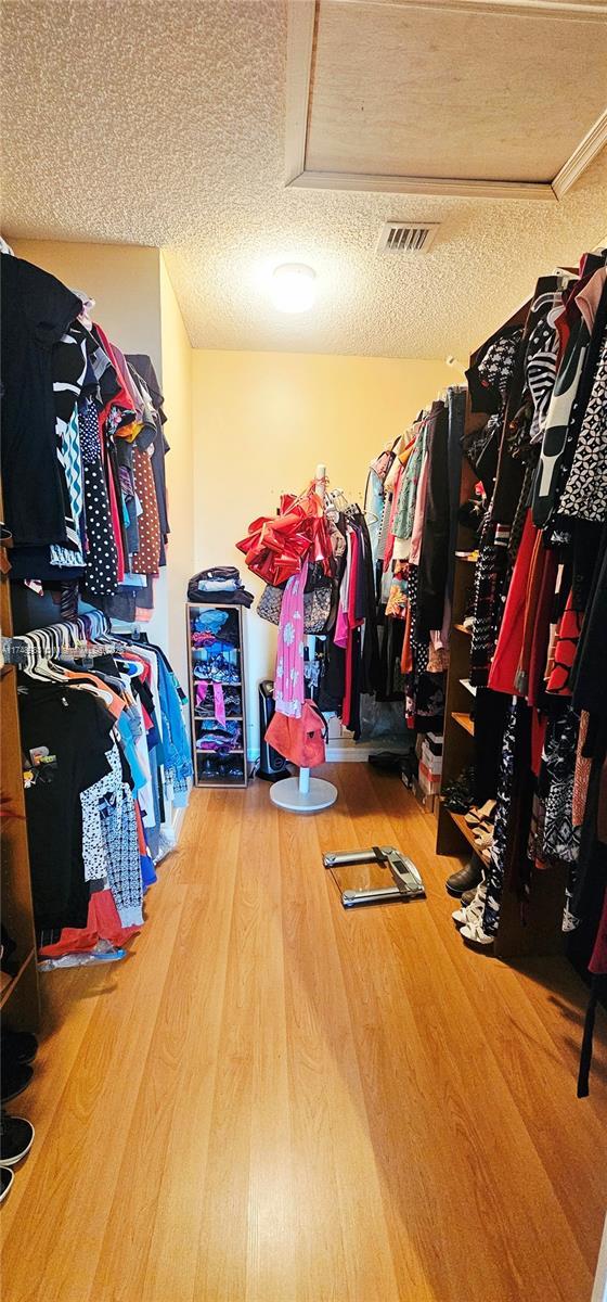 18860 NW 12th St, Pembroke Pines, FL 33029 - walk in closet with wood finished floors and attic access