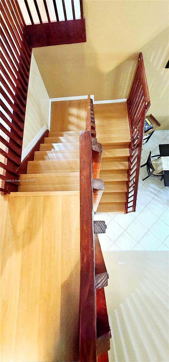 staircase with tile patterned flooring