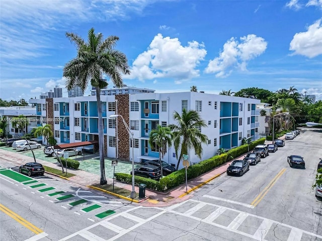 view of property featuring uncovered parking