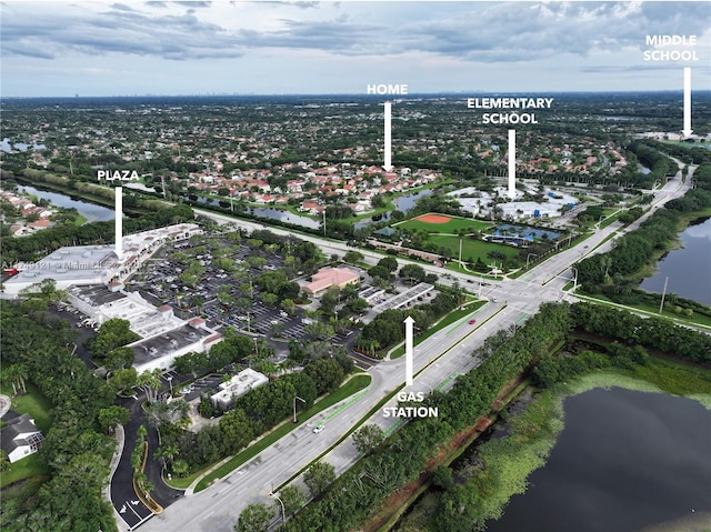 birds eye view of property with a water view