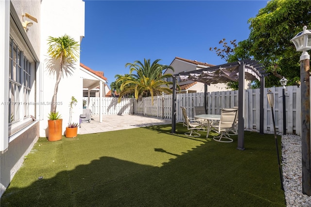 view of yard with a fenced backyard, a pergola, and a patio