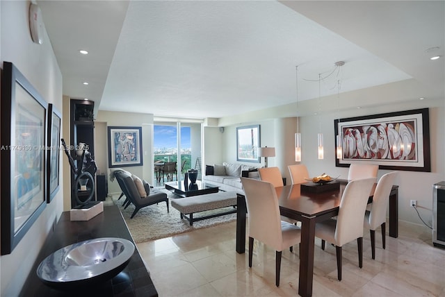 dining area with recessed lighting and light tile patterned floors