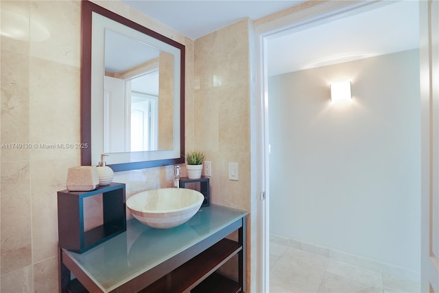 bathroom featuring tile walls and vanity