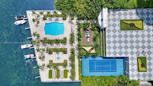 birds eye view of property with a water view