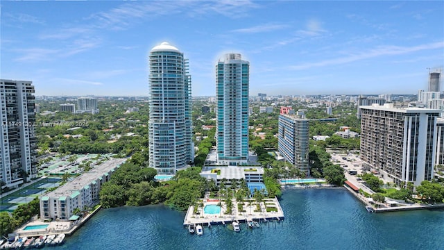 birds eye view of property featuring a water view and a city view