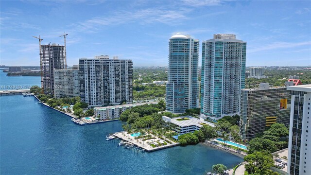 aerial view featuring a water view and a city view