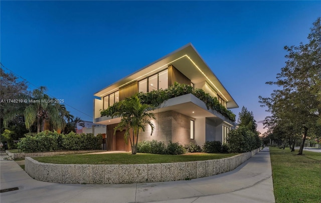 view of side of home with a yard and stucco siding