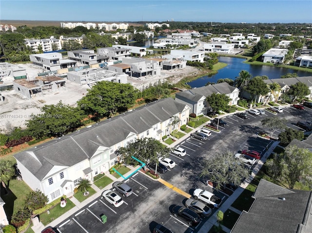 bird's eye view featuring a water view and a residential view